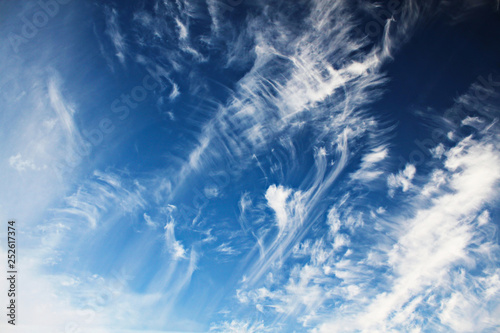 Photos Blue sky with tattered clouds