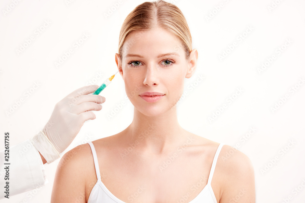 Close-up portrait of young woman having botox treatment Close-up portrait of young woman having botox treatment