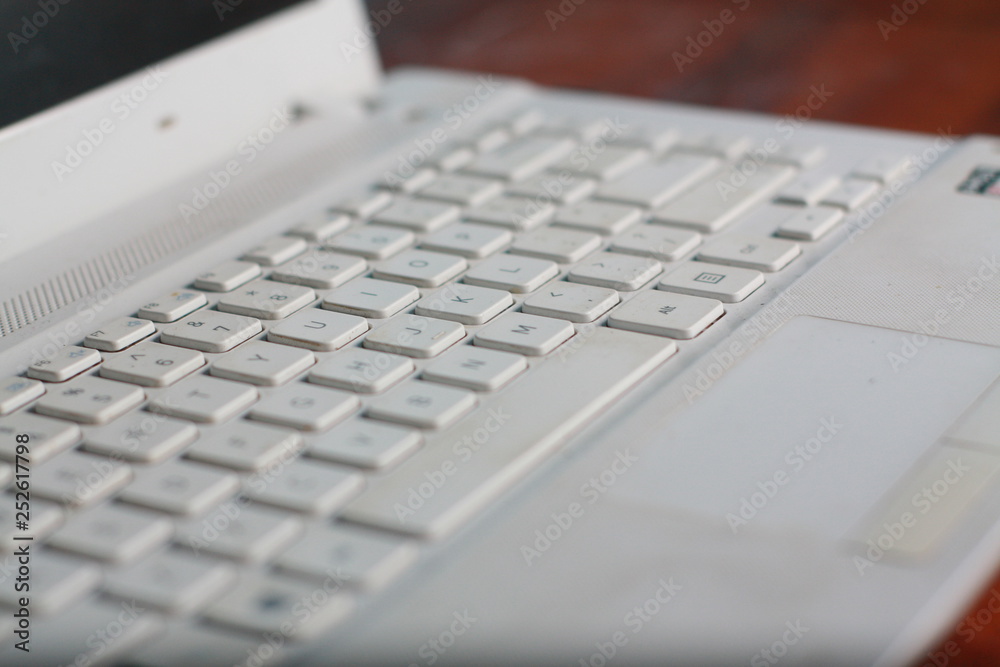 closeup of laptop typing on keyboard
