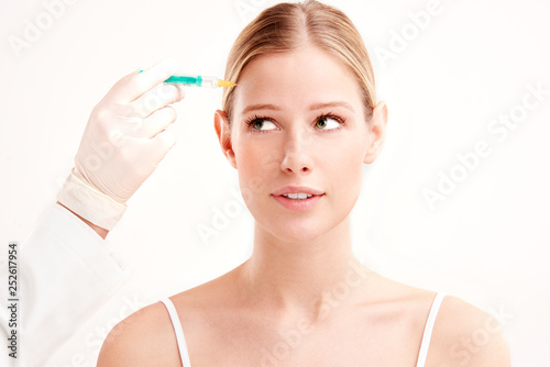 Canvas Print Close-up portrait of young woman having botox treatment