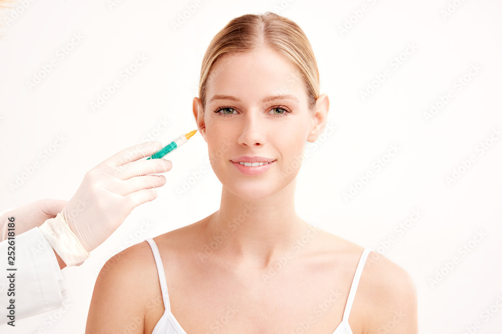 Close-up portrait of young woman having botox treatment Close-up portrait of young woman having botox treatment