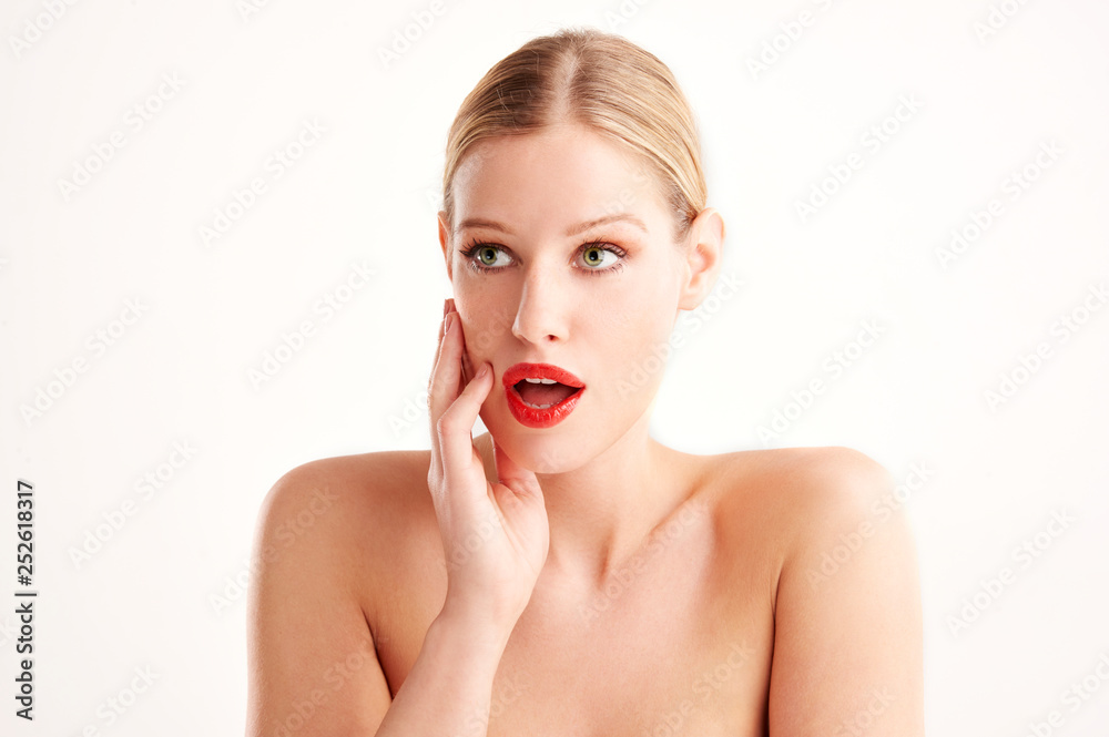 Portrait of beautiful wondered young woman with surprised face standing at isolated white background Portrait of beautiful wondered young woman with surprised face standing at isolated white background