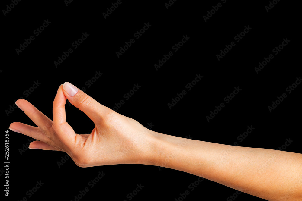 Woman hand showing mudra gesture or holding something.