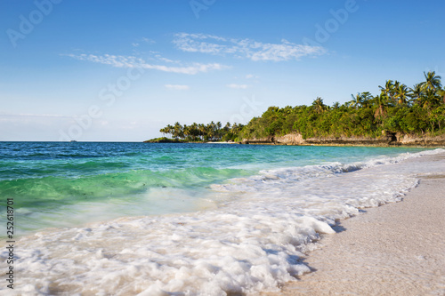 Fototapeta Naklejka Na Ścianę i Meble -  an exotic white beach with blue and turquoise water and white sand in a tranquil relaxing scene
