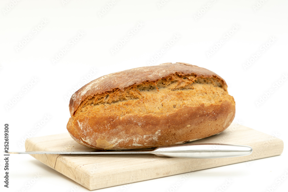 freshly baked bread lies on a wooden board