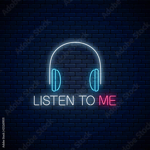 Glowing neon sign with headphones and listen to me slogan. Call to listen symbol with cheering inscription.