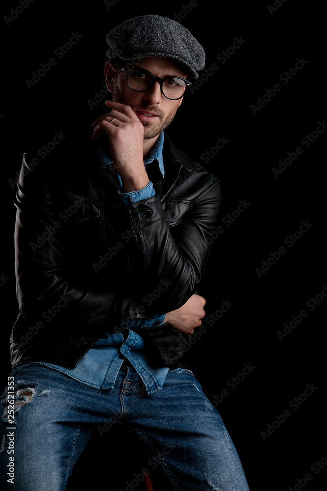 man with eyeglasses holding his hand at chin man with eyeglasses holding his hand at chin