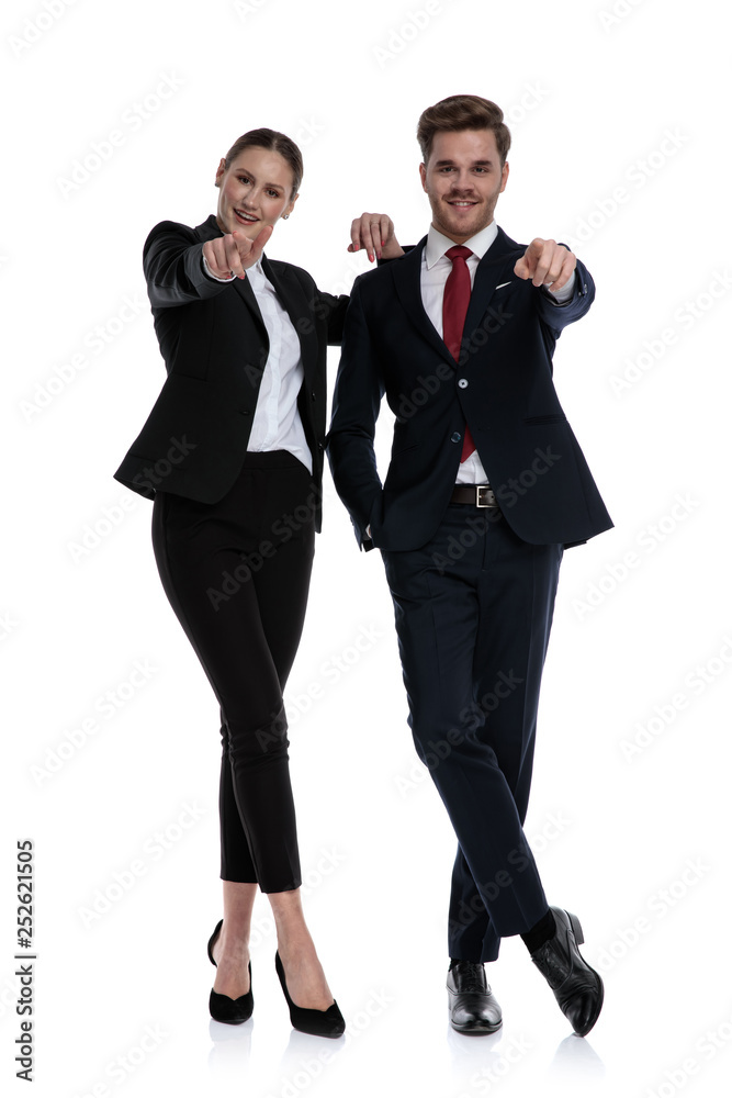 couple in business suits pointing couple in business suits pointing