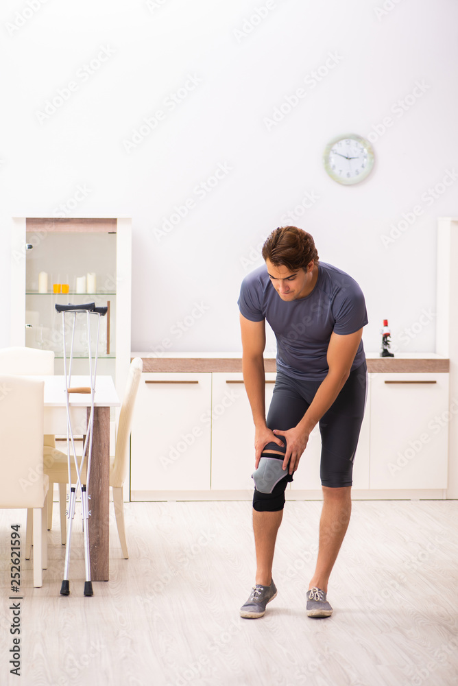 Man exercising for knee injury recovery Man exercising for knee injury recovery