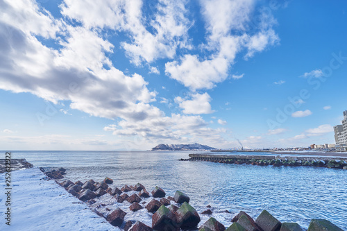 Beautiful landscape scenic of Hakodate mountain at the end of Matsukura river to ocean in Hakodate city, Hokkaido, Japan. photo