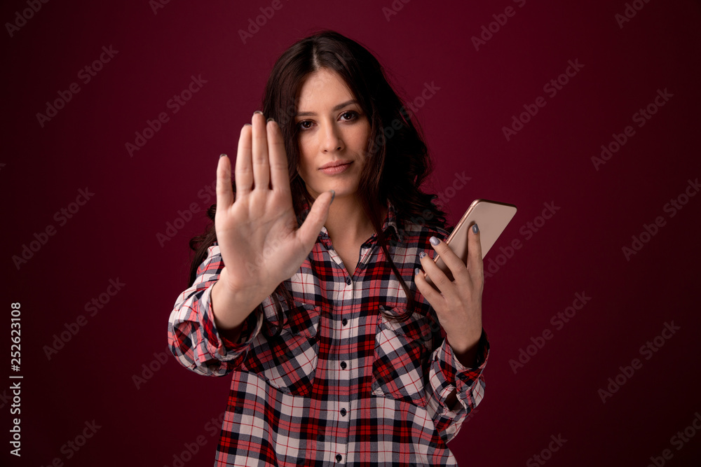 girl or young woman holding mobile phone as internet stalked victim abused in cyberbullying or cyber bullying stress concept and in smartphone and network girl or young woman holding mobile phone as internet stalked victim abused in cyberbullying or cyber bullying stress concept and in smartphone and network