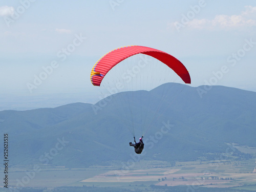 Paraglider flying from Sopot in Bulgaria