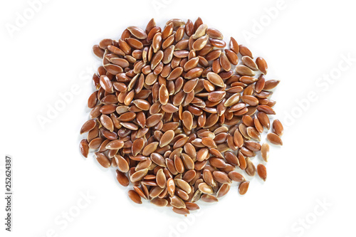 Brown flax seed on white background.