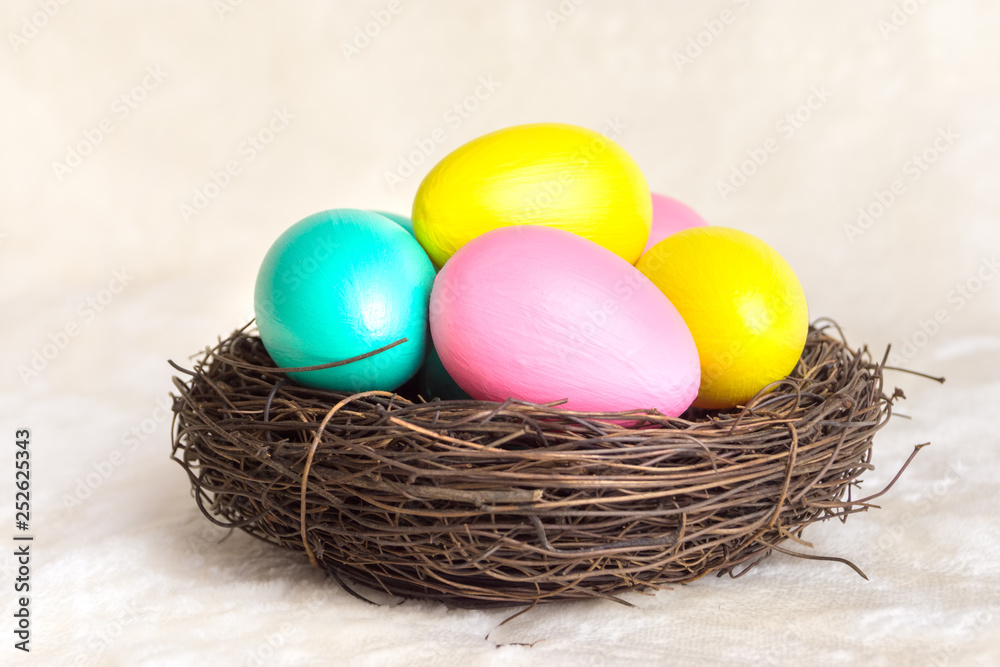 Multi-colored eggs in a nest Multi-colored eggs in a nest