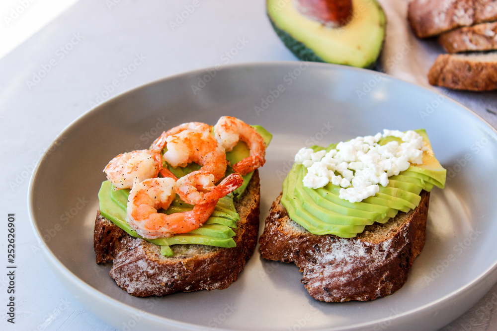 Healthy sandwiches with avocado and shrimp