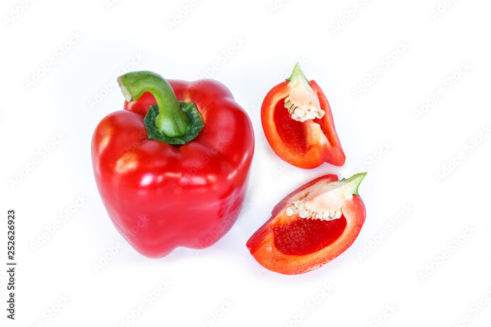 red bell pepper cut into pieces on white background, top view. red bell pepper cut into pieces on white background, top view.