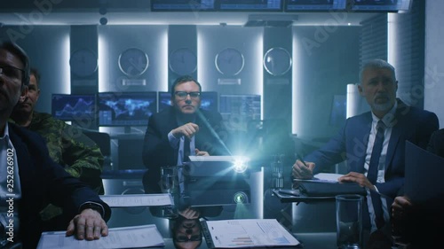 Wallpaper Mural At the Weekly Briefing Meeting CEO and Company Owner Watches Revenue Growth and Company Finances Strategy Information Shown with Laser Projector, He Makes Comments. Businesspeople in Conference Room  Torontodigital.ca