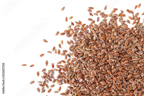Brown flax seed on white background.