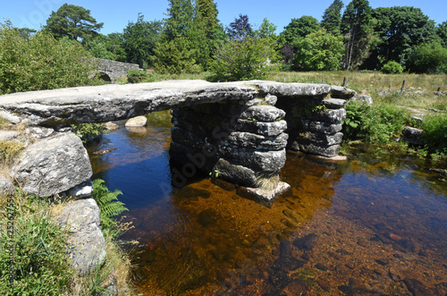 Ancient stone Clapper Bridge, Dartmoor, England. photo