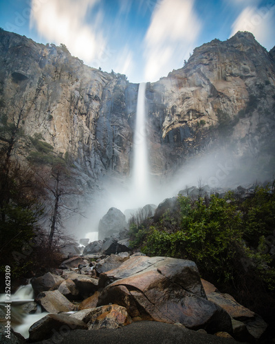 Bridalveil Falls located in Yosemite National Park during springtime. Mist and spray coming off the waterfall. 