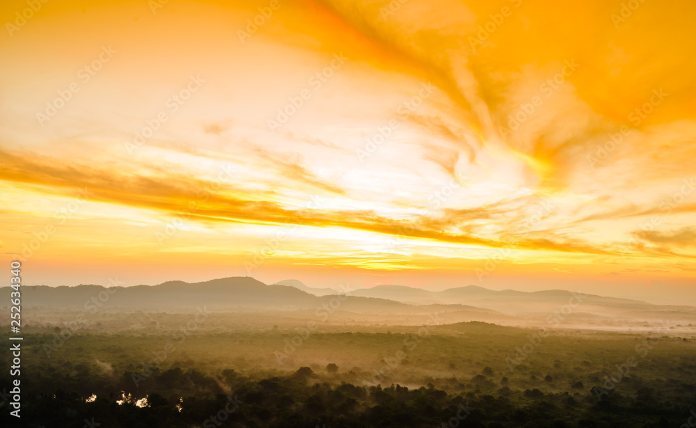 View on sunrise over the foggy jungle from Pidurangala Rock in Sri lanka - obrazy, fototapety, plakaty 