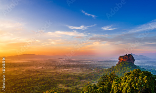 Sunrise view to Sigiriya rock - Lion Rock - from Pidurangala Rock in Sri Lanka photo