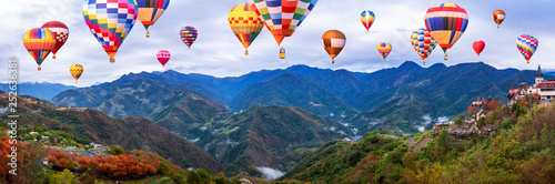 Colorful hot air balloon fly over mountain landscape of Taiwan 1 © npstockphoto