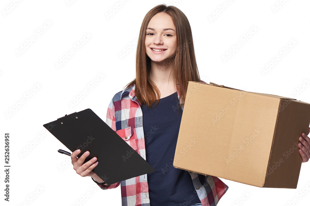 Smiling woman holding cardboard box and document signing sheet Smiling woman holding cardboard box and document signing sheet