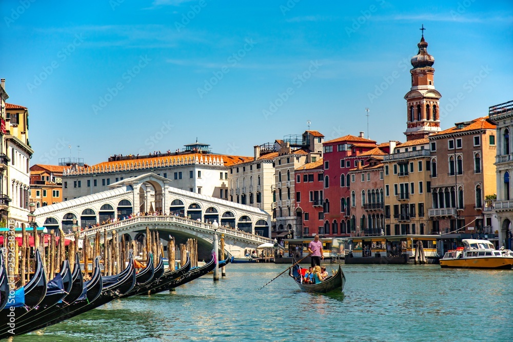 Italy beauty, gondolas close to famous Rialto bridge on Grand canal in Venice, Venezia