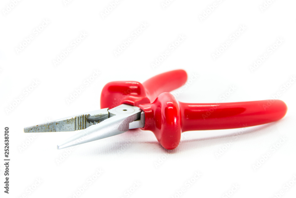 red pliers on white background red pliers on white background