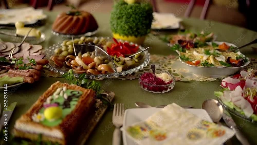 Closeup around table during easter brekfast, super slow motion Closeup around table during easter brekfast, super slow motion