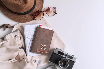 Retro camera with travel accessories and items on white background with copy space, Travel concept