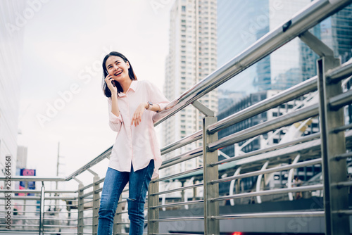 Young girl calling with smartphone and smile having talking on outdoor. technology concept.