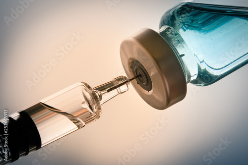 Flu vaccine bottle and syringe with needle, medicine and drug concept