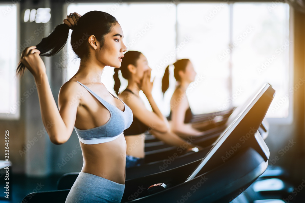 Side view of group attractive sports women on running track. Healthy, sports, lifestyle, Fitness gym concept. Side view of group attractive sports women on running track. Healthy, sports, lifestyle, Fitness gym concept.
