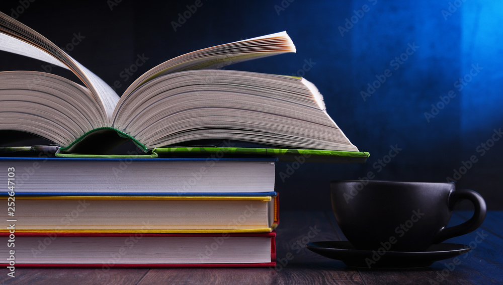 Composition with books and cup of coffee on the table Composition with books and cup of coffee on the table