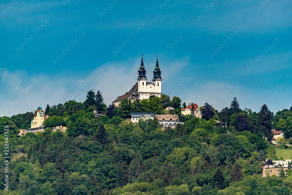 City views of the state capital Linz Austria with churches, cathedral, mountain Pöhlberg