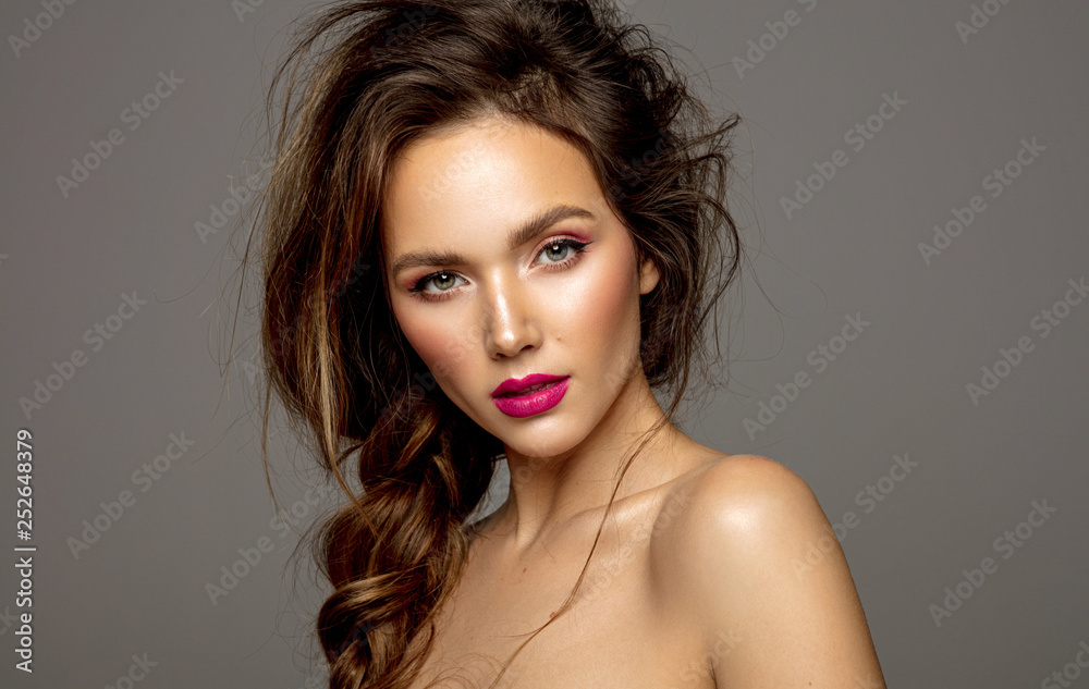 Beauty portrait of female model with messy hair and braid