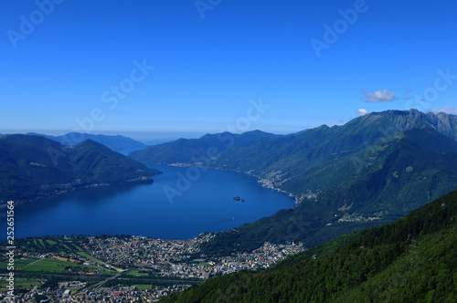 Paragliding above Lake Maggiore, Ascona and Locarno city in Ticino © gmcphotopress