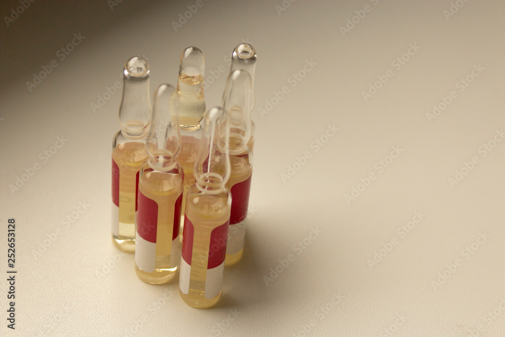 Fototapeta premium Ampoules are on the white windowsill