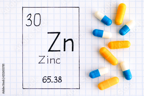 Handwriting chemical element Zinc Zn with pills.