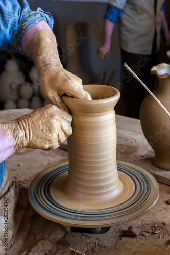 Potter's hands. Potter working with his hands in his workshop