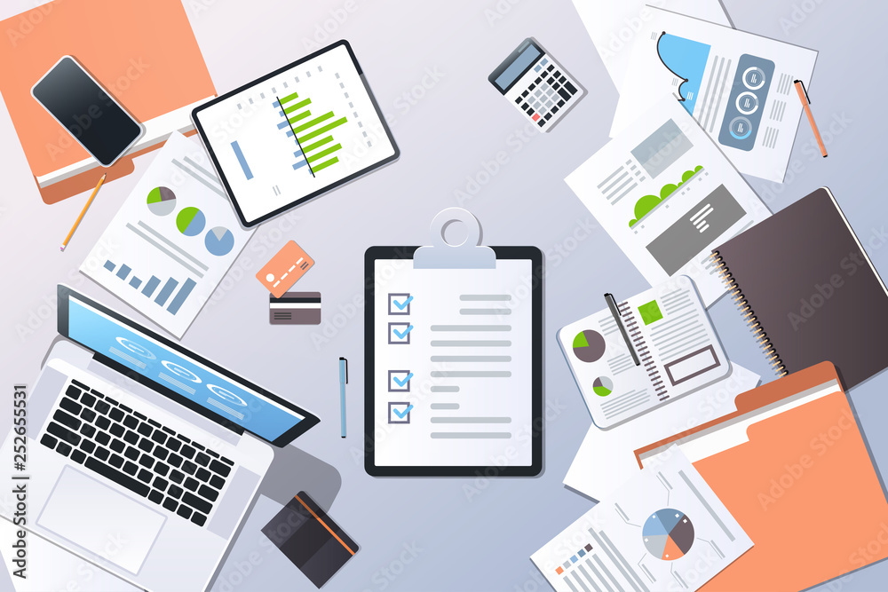 analysis financial graph business planning management concept top angle view desktop laptop smartphone checklist paper documents report office stuff horizontal