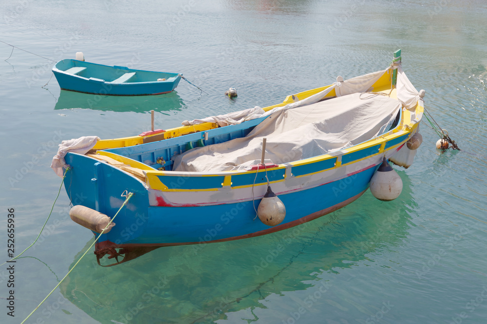Colorful traditional fishing boats in the harbor in Malta