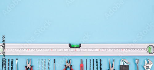 Set of construction tools on red-blue background photo