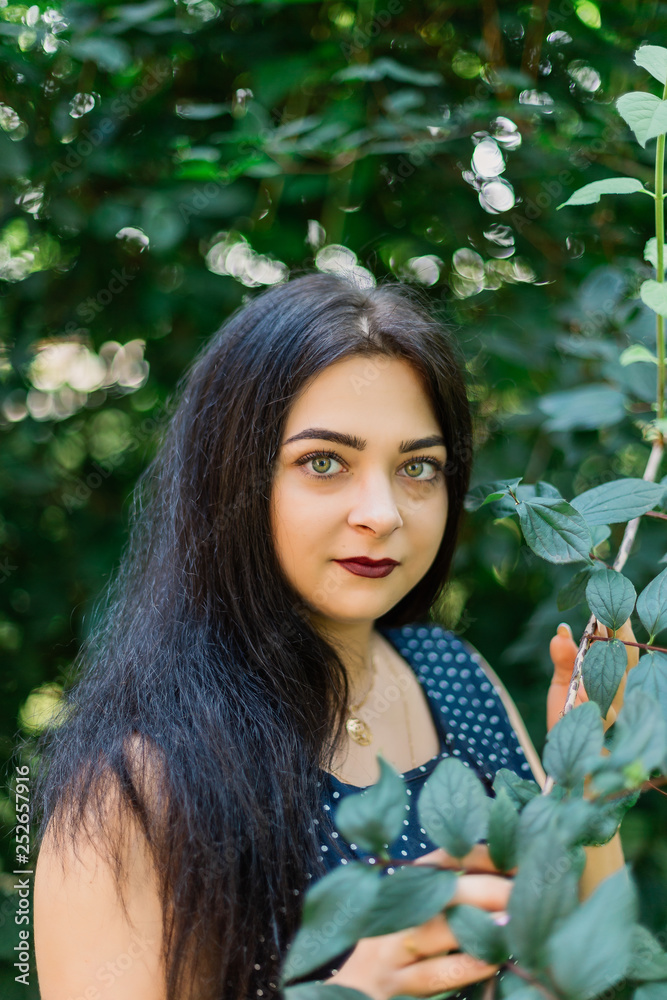 Plus size fashion model in casual clothes, overweight female body in a park outdoors. Plus size fashion model in casual clothes, overweight female body in a park outdoors.