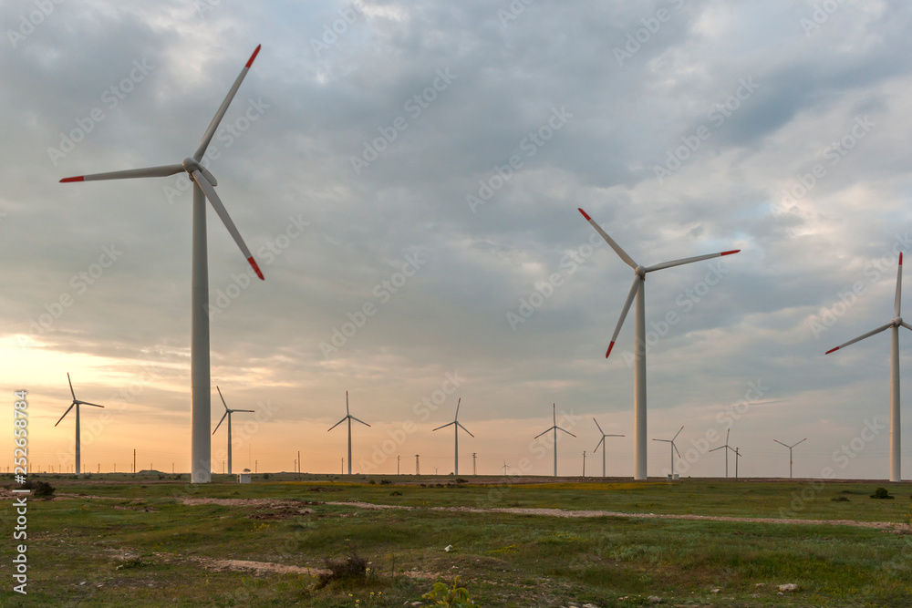 Sunset landscape with Wind turbines near Kaliakra Cape at Black Sea Coast, Dobrich Region, Bulgaria, Sunset landscape with Wind turbines near Kaliakra Cape at Black Sea Coast, Dobrich Region, Bulgaria,