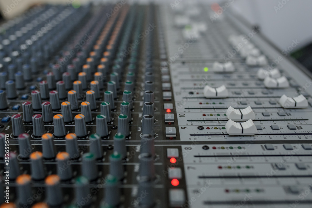Close up photo of a mixing console of a DJ
