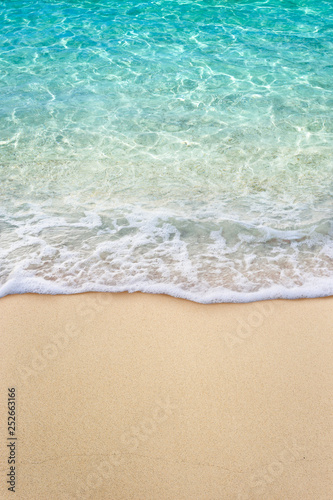 Soft blue ocean wave on clean sandy beach © OHishi_Foto