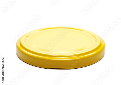 Yellow juice bottle lid isolated on white background